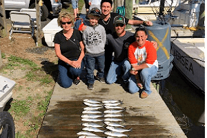 Family style OBX vacation with catch of bluefish on an inshore and near shore fishing charters.