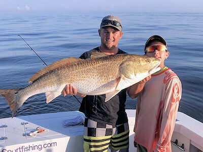 Oregon Inlet charter angler with nice red drum.